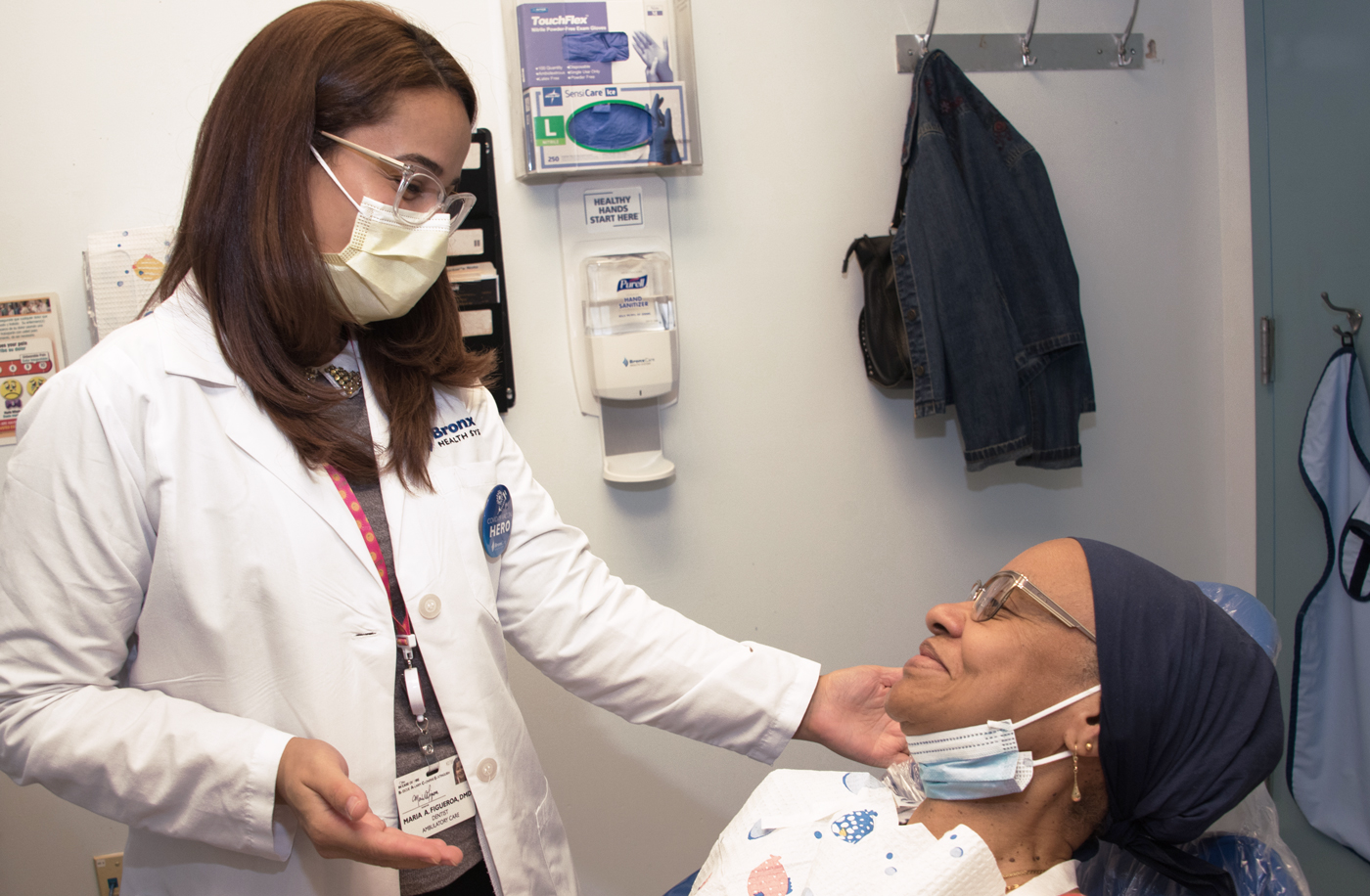 Dr. Maria Figueroa, Supervising Attending, BronxCare Dr. Martin Luther King, Jr. Dental Clinic, with patient.