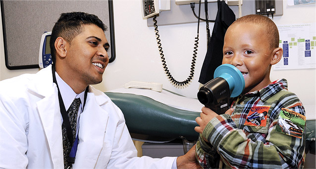 Dr. Yudhistira Persaud, Attending, Pediatrics, with patient at BronxCare Medical and Dental at Poe.